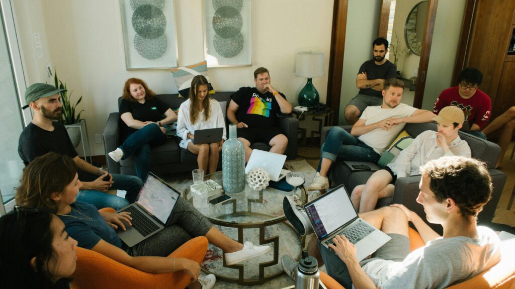 pexels-photo-2962135-2962135 Group of People Sitting on Sofa While Discussing
