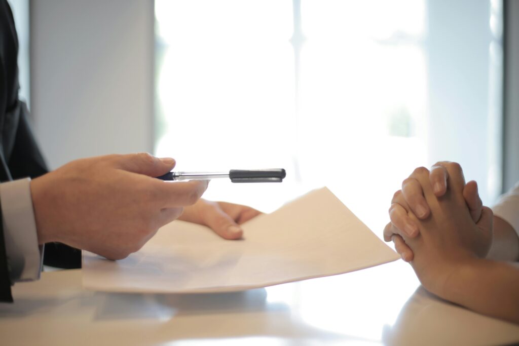 pexels-photo-3760067-3760067 Crop businessman giving contract to woman to sign